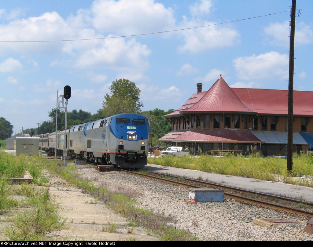 AMTK 64 leads train P092, the Silver Star past the station (under renovation)